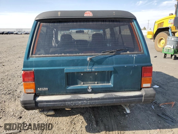 1995 Jeep Cherokee Sport with VIN 1J4FJ67S4SL519629, listed as a Copart auction lot 76107844 with 312,532 mi miles and Salvage Title. Bid and sale history available at carsss.com. Image 6.