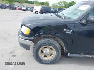 1999 Ford F-150 XL z VIN 2FTRX08L7XCA32562, wystawiony jako IAAI lot #42364671 z przebiegiem Nie podano mil oraz . Historia ofert i sprzedaży dostępna na DreamBid. Obrazek 13.