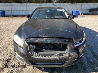 2015 Jaguar XJ with VIN SAJWA2GT8FMV83276, listed as a Copart auction lot 86521754 with 105,010 mi miles and Salvage Title. Bid and sale history available at DreamBid. Image 5.