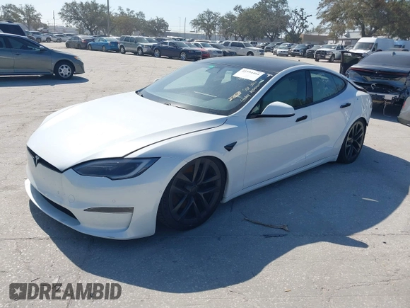 2022 Tesla Model S Plaid with VIN 5YJSA1E64NF484904, listed as a IAAI auction lot 41594464 with 25,299 mi miles and . Bid and sale history available at DreamBid. Image 2.