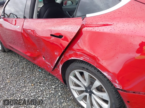 2018 Tesla Model 3 Long Range Battery z VIN 5YJ3E1EB2JF087823, wystawiony jako IAAI lot #41903609 z przebiegiem 69 749 mil mil oraz . Historia ofert i sprzedaży dostępna na DreamBid. Obrazek 6.