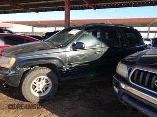 1999 Jeep Grand Cherokee Limited with VIN 1J4GW68N6XC675399, listed as a IAAI auction lot 41745815 with 217,800 mi miles. Bid and sale history available at carsss.com. Image 14.