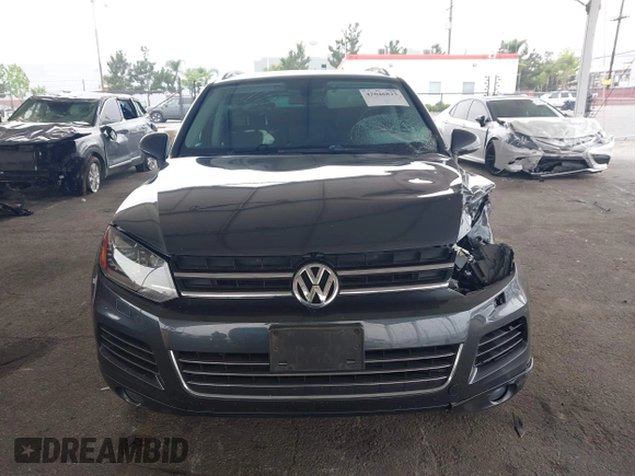 2014 Volkswagen Touareg Sport with VIN WVGEF9BP0ED015273, listed as a IAAI auction lot 42046823 with 84,694 mi miles and . Bid and sale history available at DreamBid. Image 12.