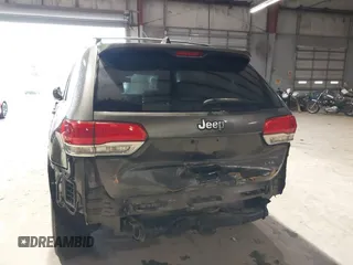 2014 Jeep Grand Cherokee Laredo with VIN 1C4RJEAG7EC145023, listed as a IAAI auction lot 40518825 with 115,098 mi miles and . Bid and sale history available at DreamBid. Image 6.