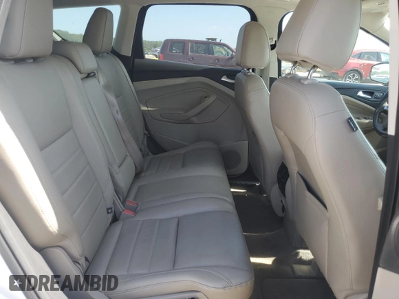 2013 Ford Escape SEL z VIN 1FMCU9H94DUC68911, wystawiony jako Copart lot #61671155 z przebiegiem 165 985 mil mil oraz Szkoda całkowita • Salvage title. Historia ofert i sprzedaży dostępna na DreamBid. Obrazek 11.