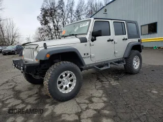 2007 Jeep Wrangler Unlimited X with VIN 1J4GA39177L105582, listed as a Copart auction lot 88912935 with 156,156 mi miles and Salvage Title. Bid and sale history available at DreamBid. Image 1.