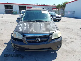 2006 Mazda Tribute i with VIN 4F2YZ02Z36KM29148, listed as a IAAI auction lot 42044163 with 175,786 mi miles and . Bid and sale history available at carsss.com. Image 12.