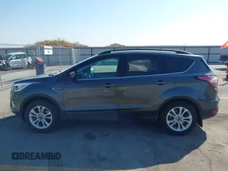 2018 Ford Escape SE z VIN 1FMCU9GD6JUD55937, wystawiony jako IAAI lot #41898592 z przebiegiem 37 800 mil mil oraz . Historia ofert i sprzedaży dostępna na DreamBid. Obrazek 15.