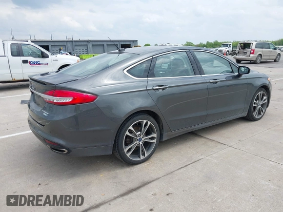 2017 Ford Fusion Titanium with VIN 3FA6P0D93HR261526, listed as a IAAI auction lot 42277350 with 117,388 mi miles and . Bid and sale history available at DreamBid. Image 4.