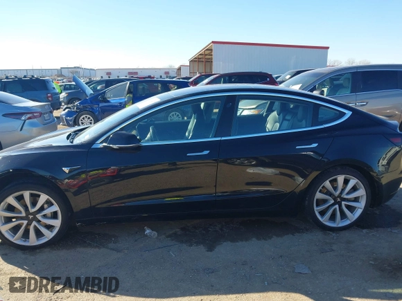 2018 Tesla Model 3 Long Range Battery with VIN 5YJ3E1EA2JF014975, listed as a IAAI auction lot 41319407 with 106,301 mi miles and . Bid and sale history available at DreamBid. Image 14.