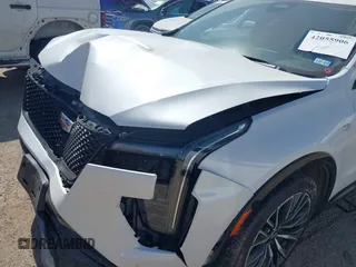 2024 Cadillac XT4 FWD Sport with VIN 1GYFZER43RF133293, listed as a IAAI auction lot 42055906 with 25,398 mi miles and . Bid and sale history available at DreamBid. Image 6.