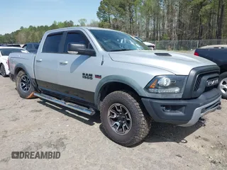 2015 Ram 1500 Rebel z VIN 1C6RR7YT0FS751334, wystawiony jako IAAI lot #41933040 z przebiegiem 167 336 mil mil oraz . Historia ofert i sprzedaży dostępna na DreamBid. Obrazek 1.