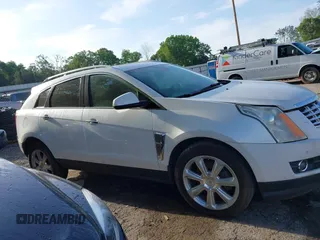 2014 Cadillac SRX Performance Collection with VIN 3GYFNCE36ES662689, listed as a IAAI auction lot 42109417 with 132,957 mi miles. Bid and sale history available at carsss.com. Image 13.