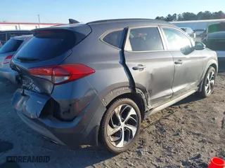 2018 Hyundai Tucson Value with VIN KM8J3CA2XJU776526, listed as a IAAI auction lot 41322657 with 102,444 mi miles. Bid and sale history available at carsss.com. Image 4.
