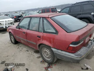 1989 Ford Escort z VIN 1FAPP959XKW361294, wystawiony jako Copart lot #83879674 z przebiegiem 12 406 mil mil oraz Szkody całkowita. Historia ofert i sprzedaży dostępna na DreamBid. Obrazek 2.