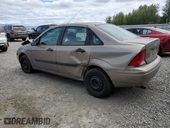 2004 Ford Focus LX with VIN 1FAFP33P24W148563, listed as a Copart auction lot 63869755 with 142,243 mi miles and Salvage title. Bid and sale history available at DreamBid. Image 2.