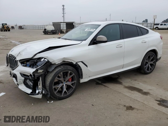 2021 BMW X6 M50i with VIN 5UXCY8C04M9D98395, listed as a Copart auction lot 85536134 with 57,891 mi miles and Salvage Title. Bid and sale history available at carsss.com. Image 1.