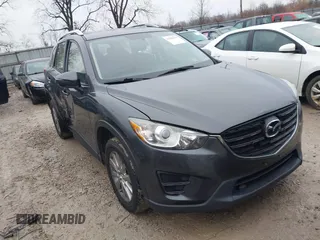 2016 Mazda CX-5 Sport with VIN JM3KE4BY5G0885754, listed as a IAAI auction lot 41103575 with 136,263 mi miles and . Bid and sale history available at carsss.com. Image 1.