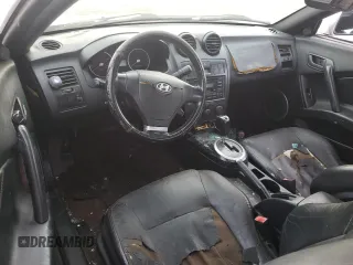 2003 Hyundai Tiburon GT z VIN KMHHN65F63U064962, wystawiony jako Copart lot #44804045 z przebiegiem 186 171 mil mil oraz Szkoda całkowita • Salvage title. Historia ofert i sprzedaży dostępna na DreamBid. Obrazek 8.