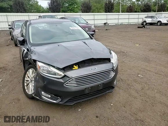 2017 Ford Focus Titanium z VIN 1FADP3N29HL240527, wystawiony jako Copart lot #62891695 z przebiegiem 126 926 mil mil oraz Szkoda całkowita • Salvage title. Historia ofert i sprzedaży dostępna na DreamBid. Obrazek 13.