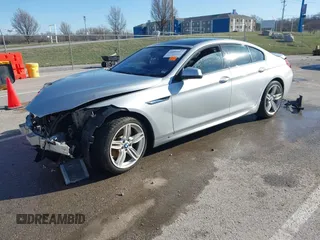 2015 BMW 6 Series 640i xDrive with VIN WBA6B8C52FD453433, listed as a IAAI auction lot 41805317 with 138,685 mi miles and . Bid and sale history available at carsss.com. Image 2.