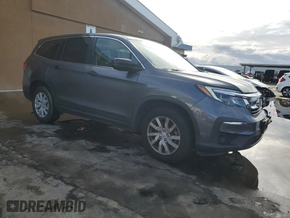 2019 Honda Pilot LX with VIN 5FNYF5H10KB026033, listed as a Copart auction lot 82578984 with 87,602 mi miles and Salvage Title. Bid and sale history available at DreamBid. Image 4.