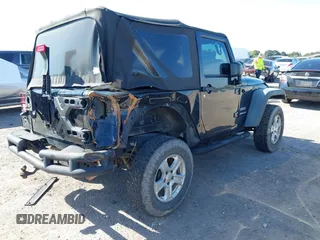2016 Jeep Wrangler Willys Wheeler z VIN 1C4AJWAG9GL257621, wystawiony jako IAAI lot #41432306 z przebiegiem 84 248 mil mil oraz . Historia ofert i sprzedaży dostępna na DreamBid. Obrazek 4.