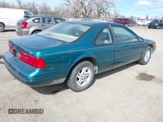 1997 Ford Thunderbird LX with VIN 1FALP62W7VH153454, listed as a IAAI auction lot 41833472 with 147,269 mi miles and . Bid and sale history available at DreamBid. Image 4.