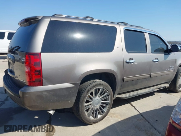 2011 Chevrolet Suburban LT with VIN 1GNSCJE03BR381301, listed as a IAAI auction lot 41412636 with 243,601 mi miles. Bid and sale history available at carsss.com. Image 4.