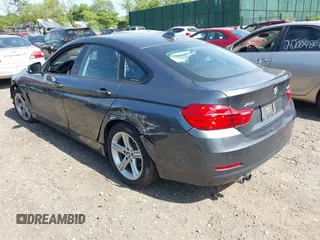 2015 BMW 4 Series 428i xDrive with VIN WBA4C9C55FD331921, listed as a IAAI auction lot 42214901 with 94,970 mi miles and . Bid and sale history available at DreamBid. Image 3.