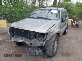 2001 Jeep Grand Cherokee Laredo z VIN 1J4GW48S01C658017, wystawiony jako IAAI lot #42160310 z przebiegiem 220 309 mil mil oraz . Historia ofert i sprzedaży dostępna na DreamBid. Obrazek 2.