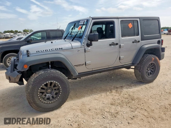 2015 Jeep Wrangler Unlimited Rubicon z VIN 1C4BJWFG0FL529310, wystawiony jako Copart lot #64337405 z przebiegiem Nie podano mil oraz Szkoda całkowita • Salvage title. Historia ofert i sprzedaży dostępna na DreamBid. Obrazek 1.