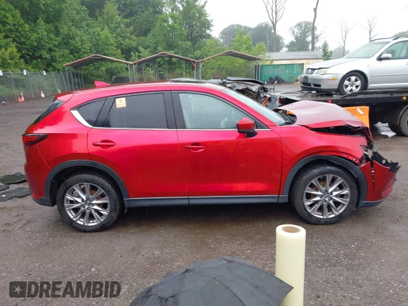2019 Mazda CX-5 Grand Touring with VIN JM3KFBDM8K0693622, listed as a IAAI auction lot 42503818 with 60,812 mi miles and . Bid and sale history available at DreamBid. Image 12.