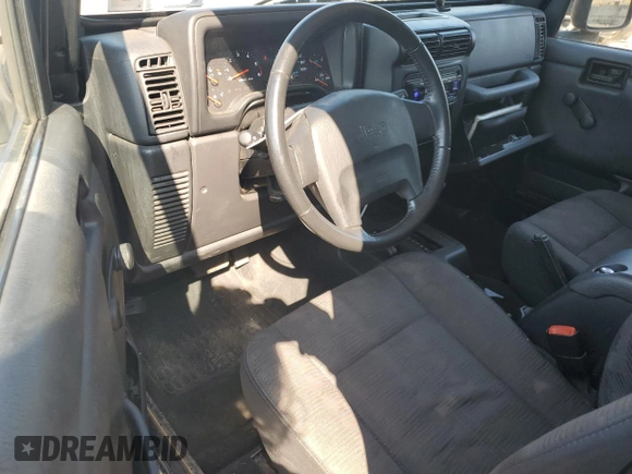 2003 Jeep Wrangler Sport z VIN 1J4FA49S13P347815, wystawiony jako Copart lot #59536685 z przebiegiem 74 298 mil mil oraz Szkoda całkowita • Salvage title. Historia ofert i sprzedaży dostępna na DreamBid. Obrazek 8.
