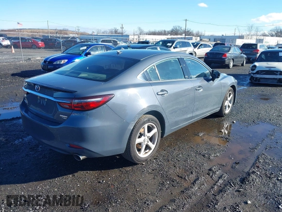 2021 Mazda 6 Carbon Edition with VIN JM1GL1WY3M1603064, listed as a IAAI auction lot 41199852 with 118,307 mi miles and . Bid and sale history available at DreamBid. Image 4.