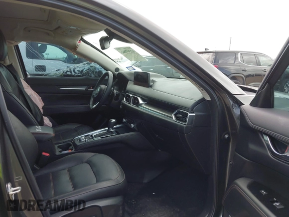 2021 Mazda CX-5 Grand Touring with VIN JM3KFBDM2M0431484, listed as a IAAI auction lot 42547665 with 34,757 mi miles and . Bid and sale history available at DreamBid. Image 5.