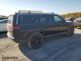 2022 Rivian R1S Launch Edition with VIN 7PDSGABL6NN001531, listed as a Copart auction lot 77143684 with 27,241 mi miles and Salvage Title. Bid and sale history available at carsss.com. Image 3.