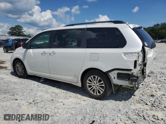 2015 Toyota Sienna XLE with VIN 5TDYK3DC0FS543020, listed as a Copart auction lot 61479225 with 221,814 mi miles and Salvage title. Bid and sale history available at DreamBid. Image 2.