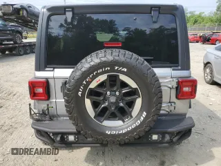 2020 Jeep Wrangler Unlimited Sport with VIN 1C4HJXDM5LW208799, listed as a Copart auction lot 61701954 with 33,873 mi miles and Salvage title. Bid and sale history available at DreamBid. Image 6.