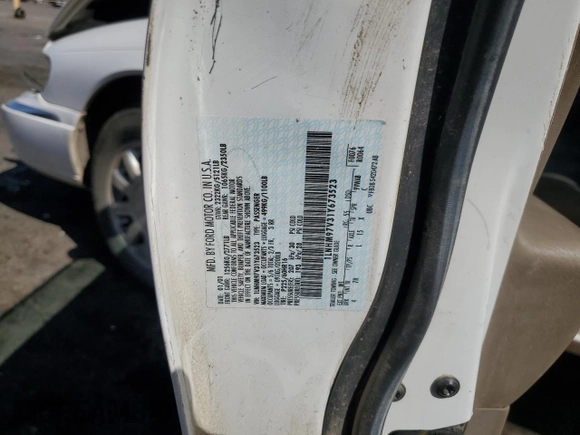 2001 Lincoln Continental z VIN 1LNHM97V31Y673523, wystawiony jako Copart lot #52451385 z przebiegiem 133 879 mil mil oraz Szkoda całkowita • Salvage title. Historia ofert i sprzedaży dostępna na DreamBid. Obrazek 12.