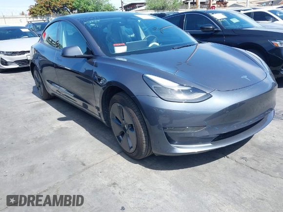 2022 Tesla Model 3 with VIN 5YJ3E1EA0NF344782, listed as a IAAI auction lot 41803469 with 16,973 mi miles and . Bid and sale history available at DreamBid. Image 1.