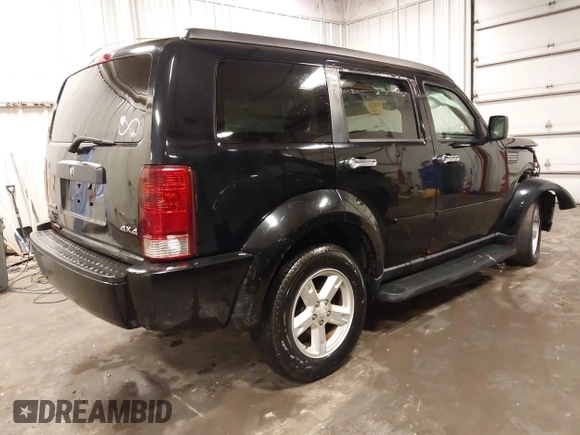 2007 Dodge Nitro SXT with VIN 1D8GU28K67W663621, listed as a IAAI auction lot 41691529 with 211,556 mi miles. Bid and sale history available at carsss.com. Image 4.