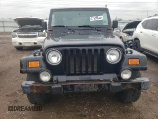 2000 Jeep Wrangler Sahara z VIN 1J4FA59S2YP714136, wystawiony jako Copart lot #57635845 z przebiegiem 178 075 mil mil oraz Czysty tytuł • Clean title. Historia ofert i sprzedaży dostępna na DreamBid. Obrazek 5.