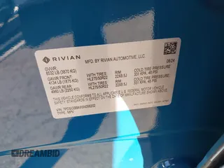 2025 Rivian R1S Adventure with VIN 7PDSGBBA9SN056202, listed as a IAAI auction lot 40766927 with 1,688 mi miles. Bid and sale history available at carsss.com. Image 9.