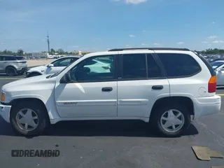 2003 GMC Envoy SLT z VIN 1GKDS13S532221928, wystawiony jako IAAI lot #42211340 z przebiegiem 149 902 mil mil oraz . Historia ofert i sprzedaży dostępna na DreamBid. Obrazek 14.