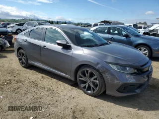 2019 Honda Civic Sport with VIN 2HGFC2F80KH523447, listed as a Copart auction lot 50557765 with 63,969 mi miles and Salvage Title. Bid and sale history available at DreamBid. Image 4.