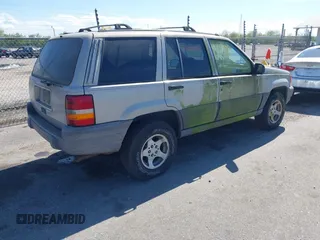 1996 Jeep Grand Cherokee Laredo with VIN 1J4FX58S2TC397006, listed as a IAAI auction lot 41836108 with 136,742 mi miles. Bid and sale history available at carsss.com. Image 4.