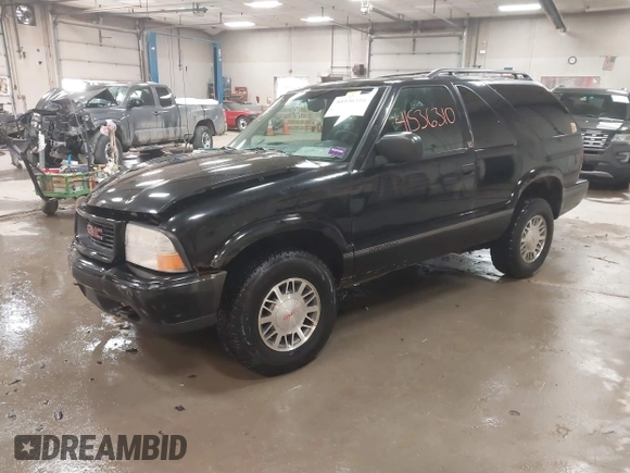 1999 GMC Jimmy SLS Comfort/Convenience with VIN 1GKCT18W1XK503719, listed as a IAAI auction lot 41536310 with 151,211 mi miles. Bid and sale history available at carsss.com. Image 17.
