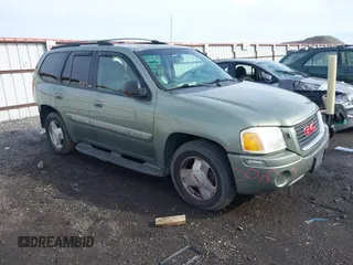 2003 GMC Envoy SLT with VIN 1GKDT13SX32161898, listed as a IAAI auction lot 41642072 with 230,154 mi miles. Bid and sale history available at carsss.com. Image 1.