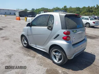2013 Smart fortwo Pure with VIN WMEEJ3BA1DK632883, listed as a IAAI auction lot 42102529 with 74,071 mi miles. Bid and sale history available at carsss.com. Image 3.